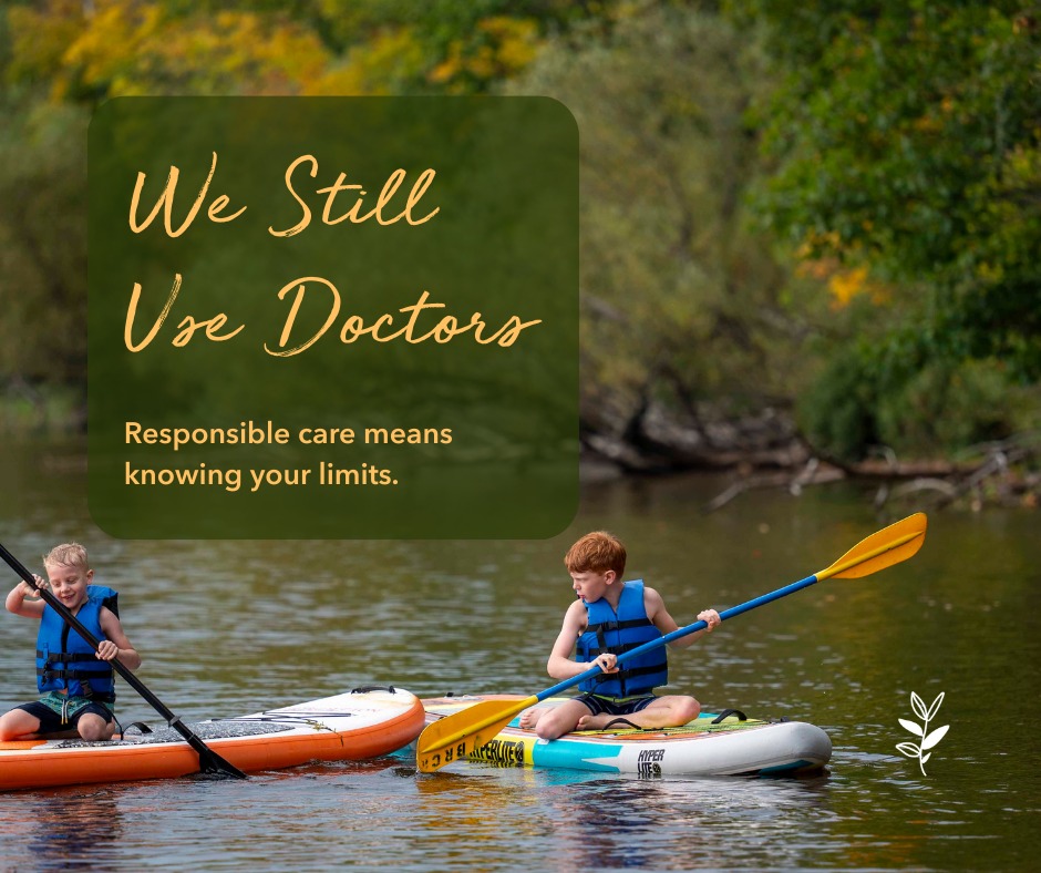 Two boys on paddleboards in a calm body of water, one paddling and the other using a paddle, with fall foliage in the background and text overlay about responsible care.